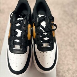 Nike Black and White Shoes with Gold Details